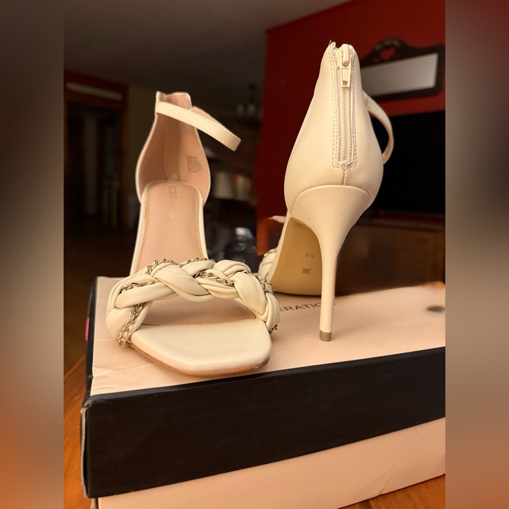 New with box BCBGeneration Bianca Isabel heels
Size 9.5 in Ivory & gold accent
